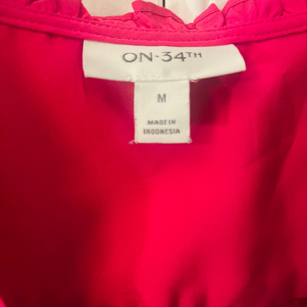 Vibrant Sleeveless Ruffle Blouse - Picture 3 of 3